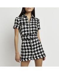 River Island - Black Dogtooth Boucle Belted Playsuit - Lyst