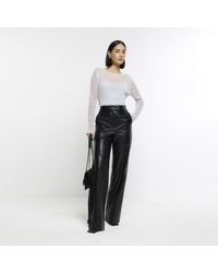 River Island - Black Faux Leather Wide Leg Trousers - Lyst