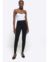 River Island - High Waisted Super Skinny Jeans - Lyst