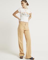 River Island - Orange High Waisted Flared Jeans - Lyst