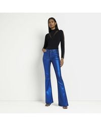 River Island - Blue Coated High Waisted Flared Jeans - Lyst