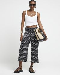 River Island - Floral Crop Wide Leg Trousers - Lyst