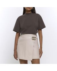 River Island - Cream Faux Leather Buckle Mini Skirt - Lyst