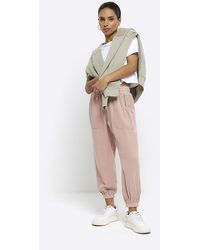 River Island - Petite Pink Lyocell Cuffed Joggers - Lyst