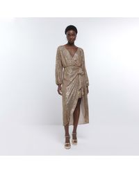 River Island - Gold Sequin Long Sleeve Wrap Dress - Lyst
