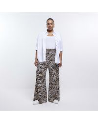 River Island - Plus Beige Leopard Print Flare Trousers - Lyst