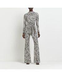 River Island - Black Jacquard Leopard Print Flare Trousers - Lyst