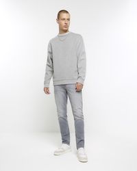 River Island - Skinny Fit Faded Jeans - Lyst