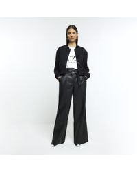 River Island - Black Faux Leather Belted Straight Trousers - Lyst