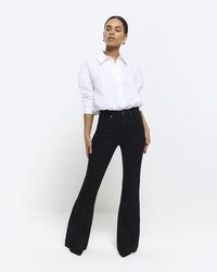 River Island - Petite Black High Waisted Flare Jeans - Lyst
