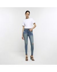 River Island - Ripped High Waisted Super Skinny Jeans - Lyst