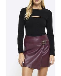 River Island - Red Faux Leather Buckle Wrap Mini Skirt - Lyst