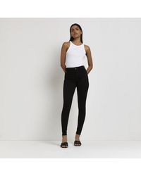 River Island - Black Molly Mid Rise Skinny Jeans - Lyst