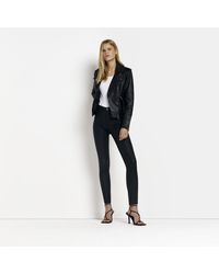 River Island - Black Molly Coated Mid Rise Skinny Jeans - Lyst