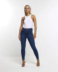 River Island - High Waist Skinny Jeans - Lyst