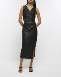 River Island - Black Faux Leather Lace Trim Midi Skirt - Lyst