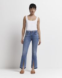 River Island - Petite Blue Mid Rise Flared Jeans - Lyst