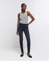 River Island - Mid Rise Skinny Jeans - Lyst