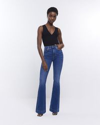 River Island - Blue High Waisted Tummy Hold Flare Jeans - Lyst