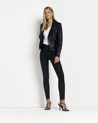 River Island - Molly Coated Mid Rise Skinny Jeans - Lyst