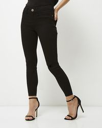 River Island - Petite Black Molly Mid Rise Skinny Jeans - Lyst