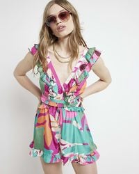 River Island - Purple Floral Frill Playsuit - Lyst