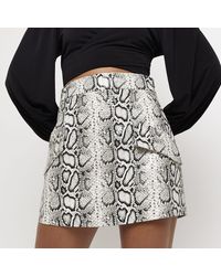 River Island - Petite Beige Faux Leather A Line Mini Skirt - Lyst