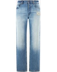 Roberto Cavalli - Jeans With Destroyed-Effect Logo - Lyst