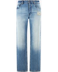 Roberto Cavalli - Jeans With Destroyed-Effect Logo - Lyst