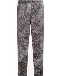 Roberto Cavalli - Faded Effect Trousers With All-Over Lettering - Lyst