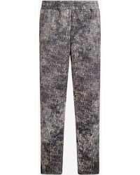 Roberto Cavalli - Faded Effect Trousers With All-Over Lettering - Lyst