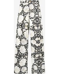 Roberto Cavalli - Pants With All-Over Floral Print - Lyst