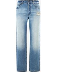 Roberto Cavalli - Jeans With Destroyed-Effect Logo - Lyst