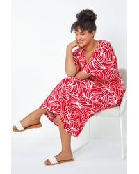 Roman Curve - Linear Print Midi Wrap Dress - Lyst