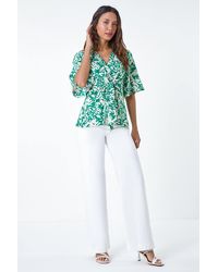 Lilly-and-Hope - Floral Print V-Neck Wrap Tie Top - Lyst