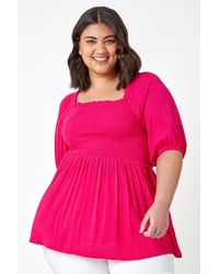 Roman Curve - Shirred Peplum Top - Lyst