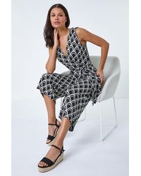 Roman - Sleeveless Shell Print Stretch Jumpsuit - Lyst