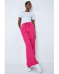 Roman - Wide Leg Elastic Waist Tie Front Trouser - Lyst