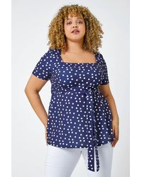 Roman Curve - Stretch Polka Dot Peplum Top - Lyst