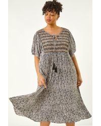 Roman Curve - Tassel Trim Printed Dress - Lyst