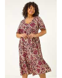 Roman Curve - Ikat Print Tiered Dress - Lyst