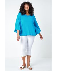 Roman Curve - Stretch Jersey Cape Sleeve Top - Lyst