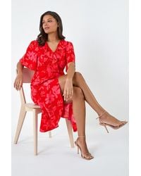 Lilly-and-Hope - Floral Print Asymmetric Midi Wrap Dress - Lyst