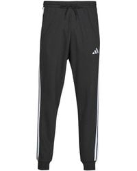 adidas - Tracksuit Bottoms Essentials 3-stripes Fleece Joggers - Lyst