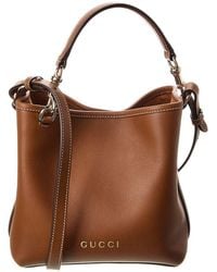 Gucci - GG Mini Emblem Leather Bucket Bag - Lyst
