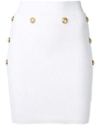 Balmain - Button-embellished Ribbed Stretch-knit Mini Skirt - Lyst