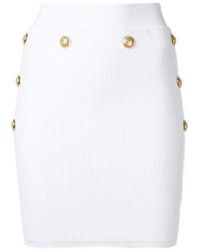 Balmain - Button-embellished Ribbed Stretch-knit Mini Skirt - Lyst
