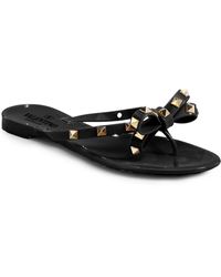 black sandals with bow on top
