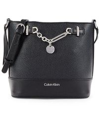 Calvin Klein Lily Monogram Logo Zip Crossbody Bag in Natural