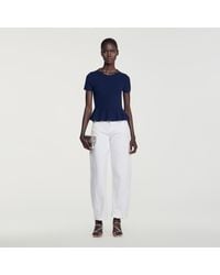 Sandro - Peplum Sweater With Rhinestone Neckline - Lyst